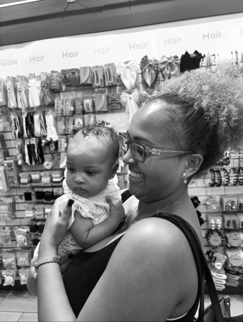 Mallery holding Maven after she got her ears pierced.